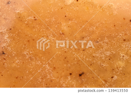 Textured pattern of melted sugar. 139413550