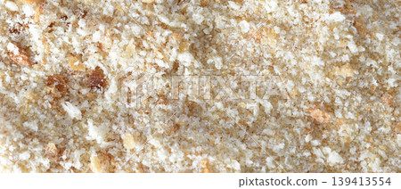 Textured pattern of bread crumbs. 139413554