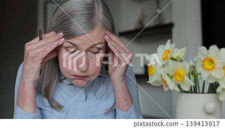 Face, sad and female person or lady with migraine crisis, pain of vertigo and fatigue. 139413917