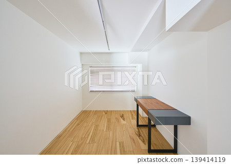 A room with hardwood floors and white walls A room with hardwood floors and white walls 139414119