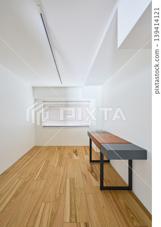 A room with hardwood floors and white walls A room with hardwood floors and white walls 139414121
