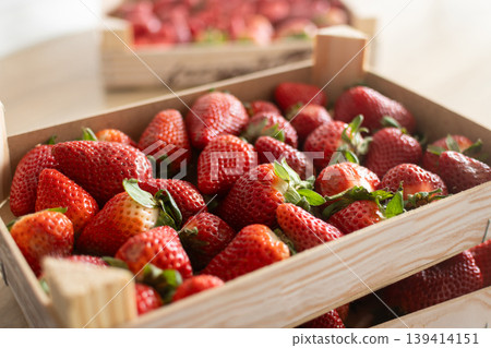 Fresh strawberries on wooden boxes Fresh strawberries on wooden boxes 139414151