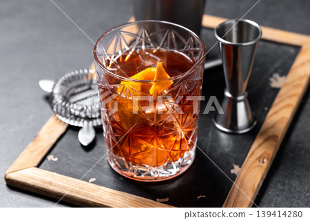 Old Fashioned Cocktail with Orange Peel on black background 139414280