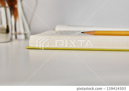 Pencil on opened book Pencil on opened book 139414303