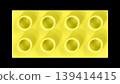 Pastel Yellow Plastic Building Lego Block with Eight Studs on Black Background 139414415