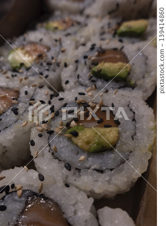 Close view of salmon avocado sushi rolls Close view of salmon avocado sushi rolls 139414860