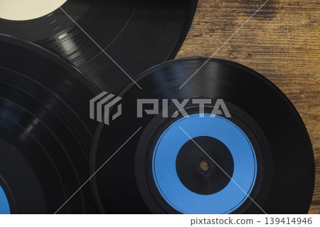 Vintage vinyl records on wooden table Vintage vinyl records on wooden table 139414946