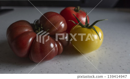 Variety of fresh tomatoes on white background side view Variety of fresh tomatoes on white background side view 139414947