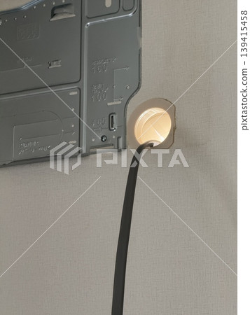 Air conditioner installation work: back panel and piping hole Air conditioner installation work: back panel and piping hole 139415458
