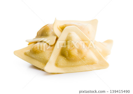 Uncooked Italian Filled Pasta Dumplings Stacked On White Background Close Up Fresh Homemade Ravioli Uncooked Italian Filled Pasta Dumplings Stacked On White Background Close Up Fresh Homemade Ravioli 139415490