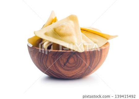 Fresh Triangular Ravioli Pasta In Wooden Bowl On White Background, Uncooked And Ready To Cook 139415492