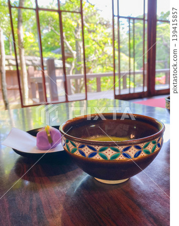 Matcha set with a Japanese garden background Matcha set with a Japanese garden background 139415857