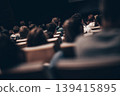 Rear view of unrecognizable people in audience at the conference hall. Business and entrepreneurship symposium 139415895