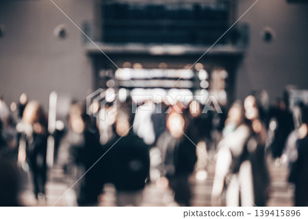 Abstract blurred people at exhibition hall of expo event trade show. Business convention show or job fair. Business concept background Abstract blurred people at exhibition hall of expo event trade show. Business convention show or job fair. Business concept background 139415896