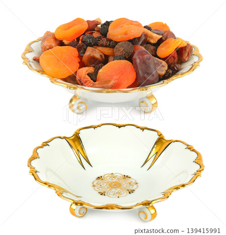 Traditional dessert presentation with dehydrated fruits and antique ceramic bowl. 139415991