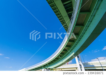 Osaka City, Hanshin Expressway Yodogawa Left Bank Line, Ebie Junction, shining brightly against the blue sky Osaka City, Hanshin Expressway Yodogawa Left Bank Line, Ebie Junction, shining brightly against the blue sky 139416071