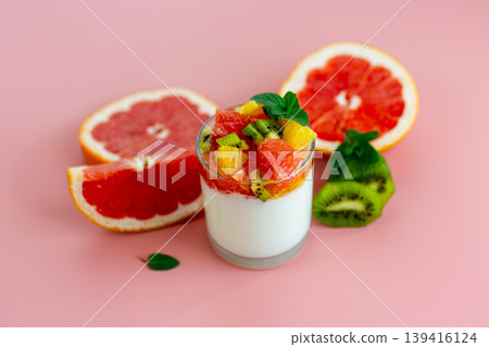 bright fruit composition with yogurt glass and grapefruit kiwi orange slices 139416124