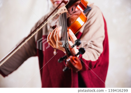 Woman playing the violin: Front view, close-up of left hand, bright atmosphere 2 Woman playing the violin: Front view, close-up of left hand, bright atmosphere 2 139416299