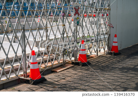 Construction site's day off: Foundation work and bellows gate Construction site's day off: Foundation work and bellows gate 139416370