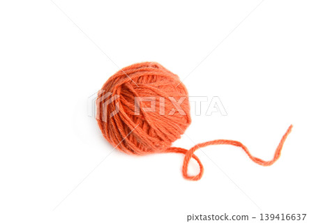 Vibrant orange yarn clew for knitting and handmade crafts isolated on white background. Vibrant orange yarn clew for knitting and handmade crafts isolated on white background. 139416637