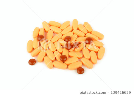 Assorted oval and round medicine pills in a heap isolated on white background. 139416639