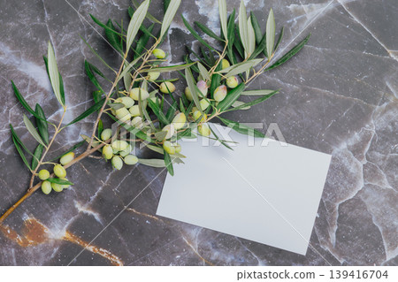 Mediterranean travel concept with olive branch and white card for text. Mediterranean travel concept with olive branch and white card for text. 139416704