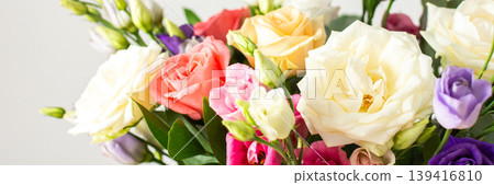 This seasonal bouquet of roses, eucalyptus, and eustoma in soft pink, white, and purple tones makes an ideal gift for anniversaries, birthdays, or any special event, banner This seasonal bouquet of roses, eucalyptus, and eustoma in soft pink, white, and purple tones makes an ideal gift for anniversaries, birthdays, or any special event, banner 139416810