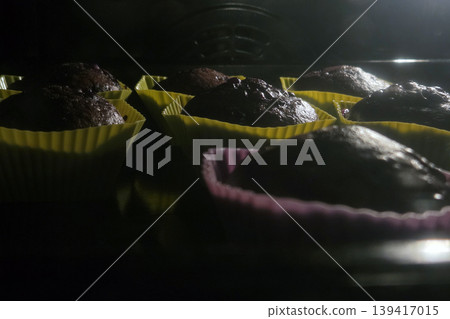 Baking Chocolate Cupcakes in Colorful Silicone Molds - Culinary Delight Baking Chocolate Cupcakes in Colorful Silicone Molds - Culinary Delight 139417015
