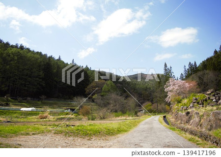 Springtime rural scenery around Izuhaya Kohagi Shrine in Okaya City, Nagano Prefecture Springtime rural scenery around Izuhaya Kohagi Shrine in Okaya City, Nagano Prefecture 139417196
