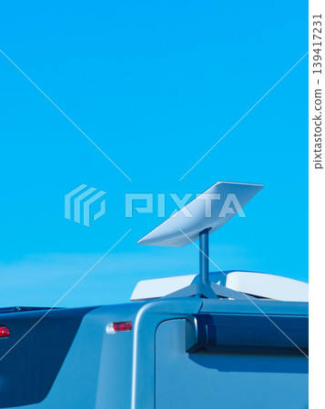 Awning on side of caravan and Starlink terminal on roof Awning on side of caravan and Starlink terminal on roof 139417231