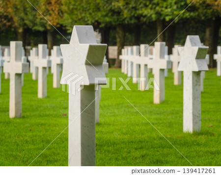 St. Mihiel American Cemetery in Thiaucourt France. White crosses and gravestone with a star of David St. Mihiel American Cemetery in Thiaucourt France. White crosses and gravestone with a star of David 139417261