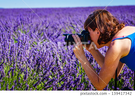 Woman with camera take photo from lavender field, Provence France 139417342