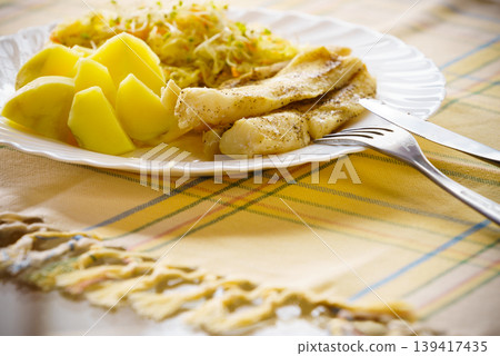 Dinner meal fish with salad and potatoes Dinner meal fish with salad and potatoes 139417435