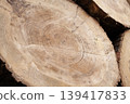 Pile of wood logs, closeup of clean cut of chopped firewood log. Natural wooden background 139417833