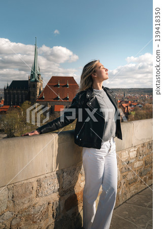 Woman Relaxing at Historic European Viewpoint in Sunlight Woman Relaxing at Historic European Viewpoint in Sunlight 139418350