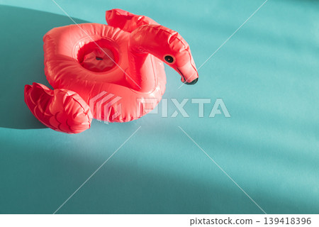 Pink Flamingo Shaped Pool Float on Turquoise Water Pink Flamingo Shaped Pool Float on Turquoise Water 139418396