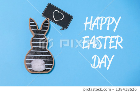 Rabbit is holding a heart and the words Happy Easter Day are written below it Rabbit is holding a heart and the words Happy Easter Day are written below it 139418626