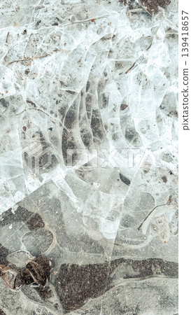 Abstract close-up of cracked ice surface with intricate patterns and textures, showcasing natural beauty and unique formations in a frozen environment Abstract close-up of cracked ice surface with intricate patterns and textures, showcasing natural beauty and unique formations in a frozen environment 139418657