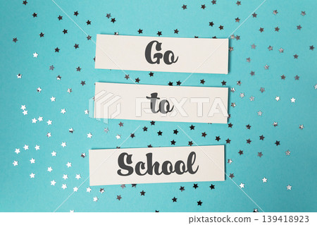 Blue background with a white sign that says Go to School. Blue background with a white sign that says Go to School. 139418923