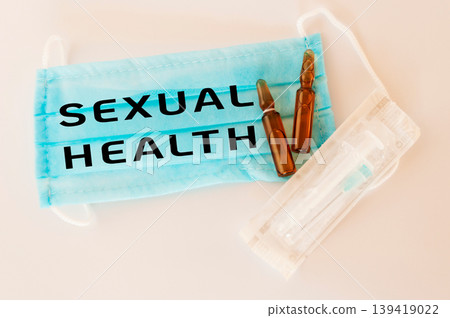 Blue surgical mask with the word sexual health written on it Blue surgical mask with the word sexual health written on it 139419022