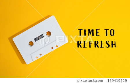 Vintage cassette tape on bright yellow background with motivational text for creative projects Vintage cassette tape on bright yellow background with motivational text for creative projects 139419229