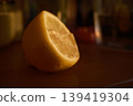 close up of lemon slices in a glass on wooden table 139419304