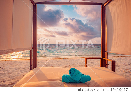 Stunning beach canopy sunset with ocean view for luxury vacation and vibrant relaxation featuring a serene travel background and tropical resort mood Stunning beach canopy sunset with ocean view for luxury vacation and vibrant relaxation featuring a serene travel background and tropical resort mood 139419417