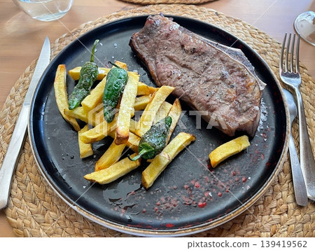 Txuleton Beef Steak on Grill with Juicy Texture Txuleton Beef Steak on Grill with Juicy Texture 139419562