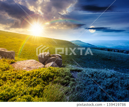 day meet night. mountain summer time landscape. sun and moon over meadow with giant stones among the grass on the hillside. epic view near the peak of mountain smooth at twilight. harmony concept day meet night. mountain summer time landscape. sun and moon over meadow with giant stones among the grass on the hillside. epic view near the peak of mountain smooth at twilight. harmony concept 139419786