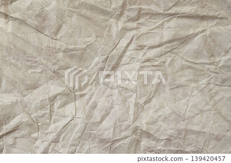 Crumpled paper texture with natural folds and cream beige recycled paper surface. Natural background of paper, rustic design, Paper Mockup, creative projects 139420457