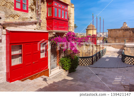 Narrow historic street with traditional balconies in Valletta Malta 139421147