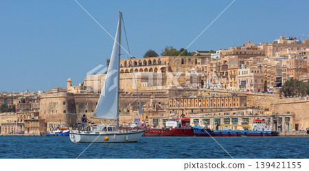 Sailing yacht in Grand Harbour with historic Valletta waterfront Malta 139421155