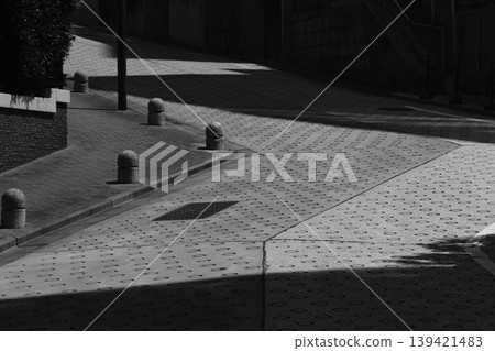 Graphics of light and shadow: Geometric patterns etched into the slopes and the shadows of the city. Graphics of light and shadow: Geometric patterns etched into the slopes and the shadows of the city. 139421483