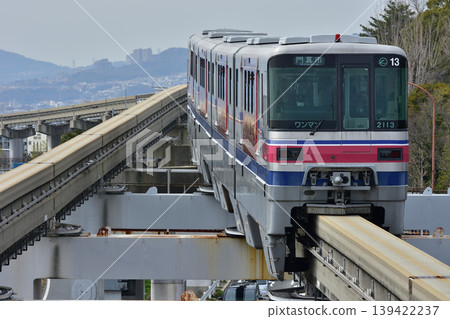 Osaka Monorail 2000 series arriving at Shibahara-Handai-mae Station Osaka Monorail 2000 series arriving at Shibahara-Handai-mae Station 139422237
